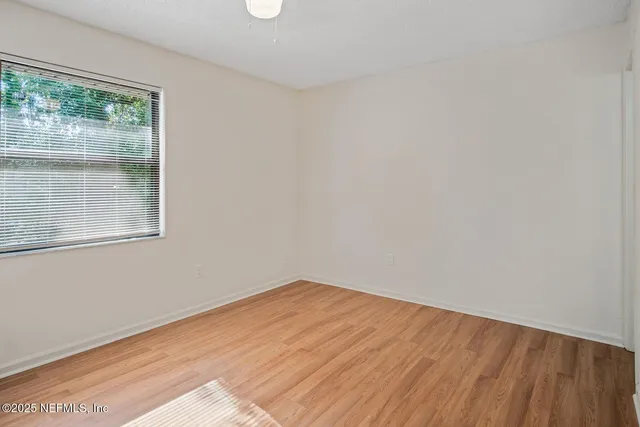 a bathroom with a bathtub shower sink vanity and toilet