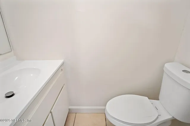 a white toilet sitting next to a bath tub