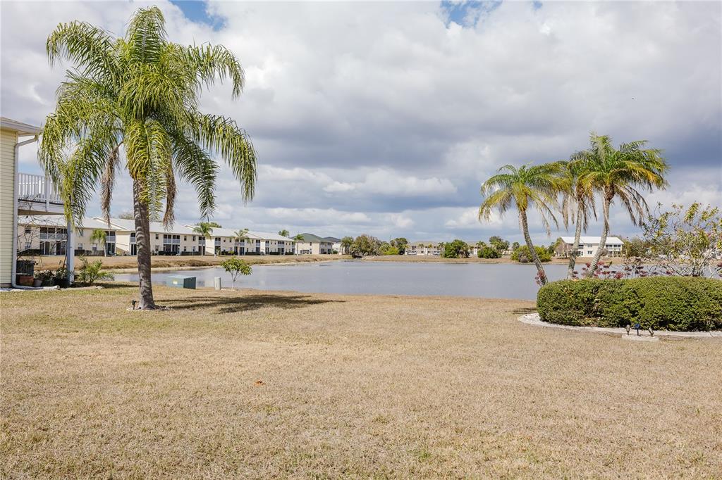 26282 Rampart Boulevard, Unit 204 Punta Gorda, FL 33983 - Photo 16 of 34 a view of a swimming pool and lake view