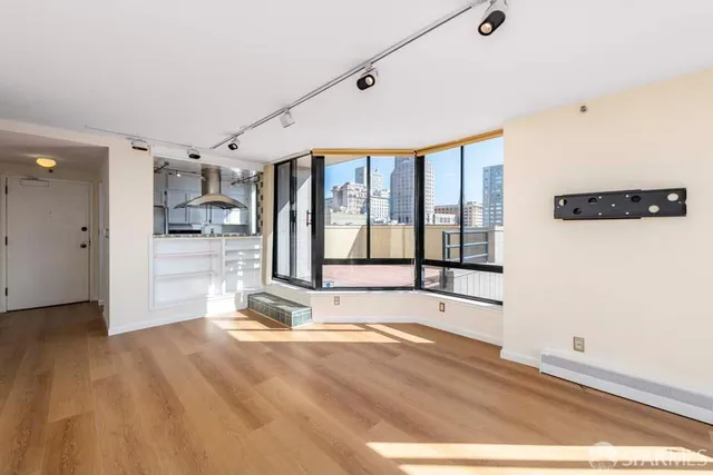 a view of an empty room with a window