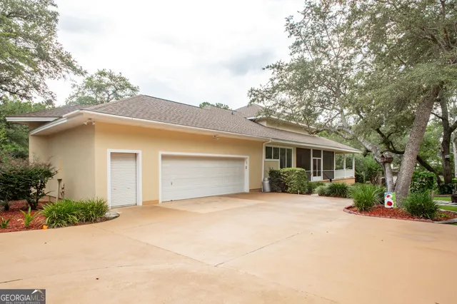 a building outdoor space with patio furniture and potted plants