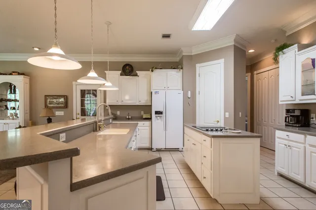 a bedroom with a bed dresser and a window