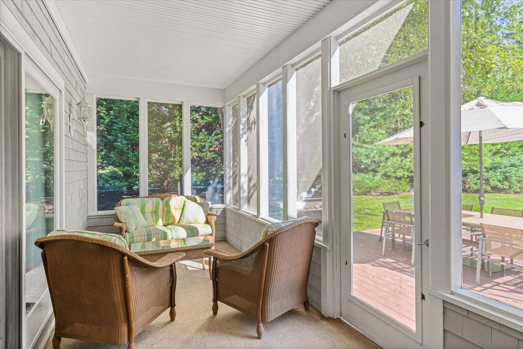 33 Post Fields Lane Quogue, NY 11959 - Photo 14 of 30 a dining room with furniture and wooden floor
