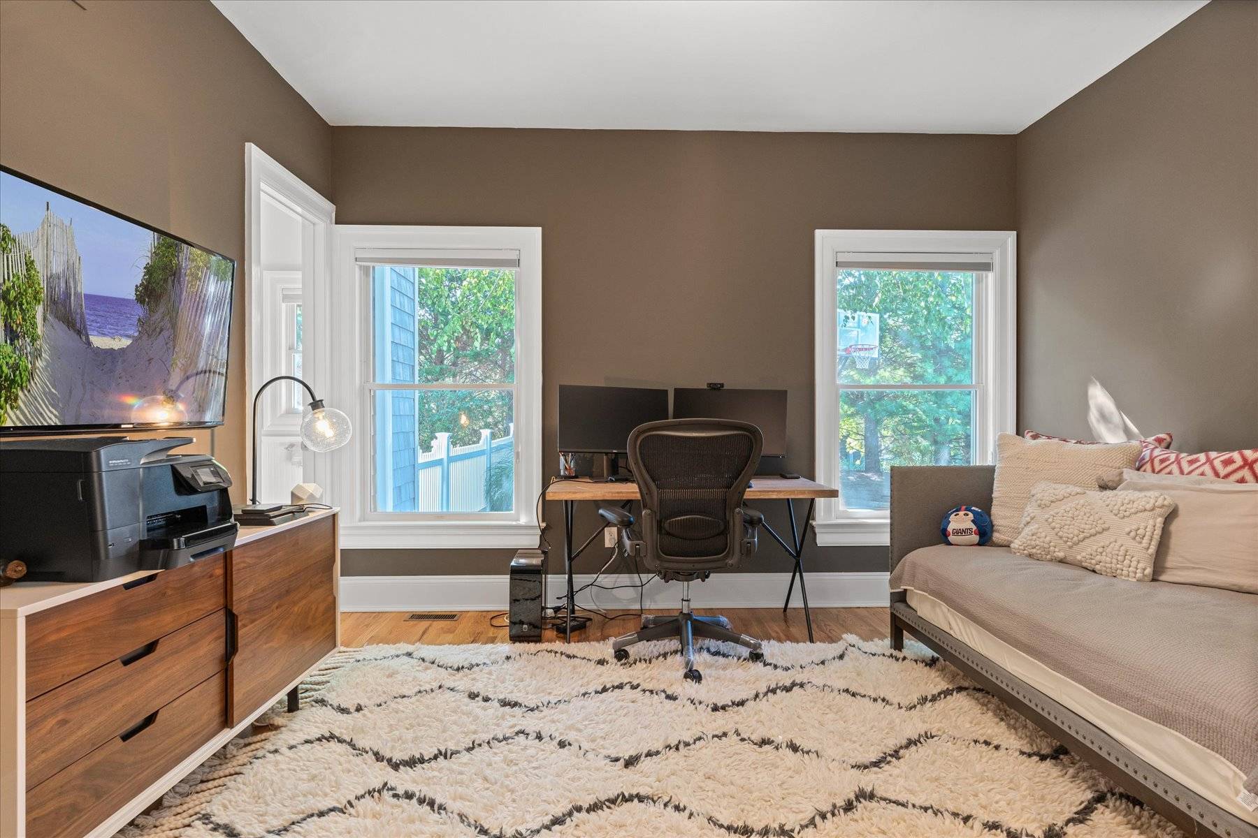 33 Post Fields Lane Quogue, NY 11959 - Photo 15 of 30 a living room with furniture fireplace and a flat screen tv