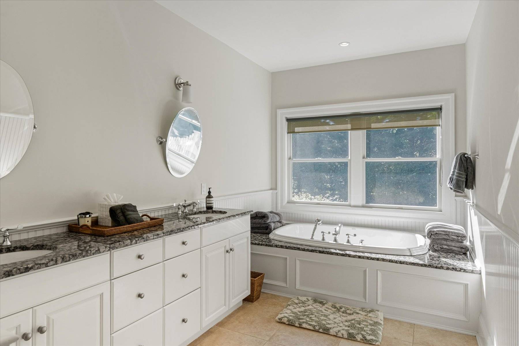 33 Post Fields Lane Quogue, NY 11959 - Photo 18 of 30 a bathroom with a granite countertop sink and a large mirror