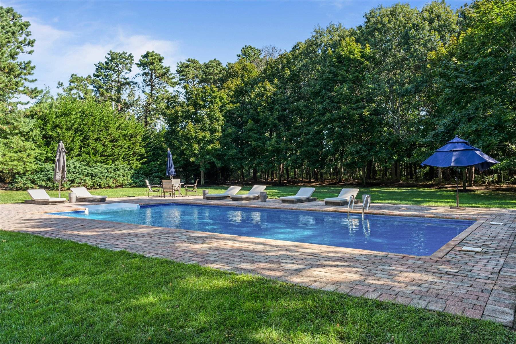 33 Post Fields Lane Quogue, NY 11959 - Photo 27 of 30 a view of a yard with a small yard