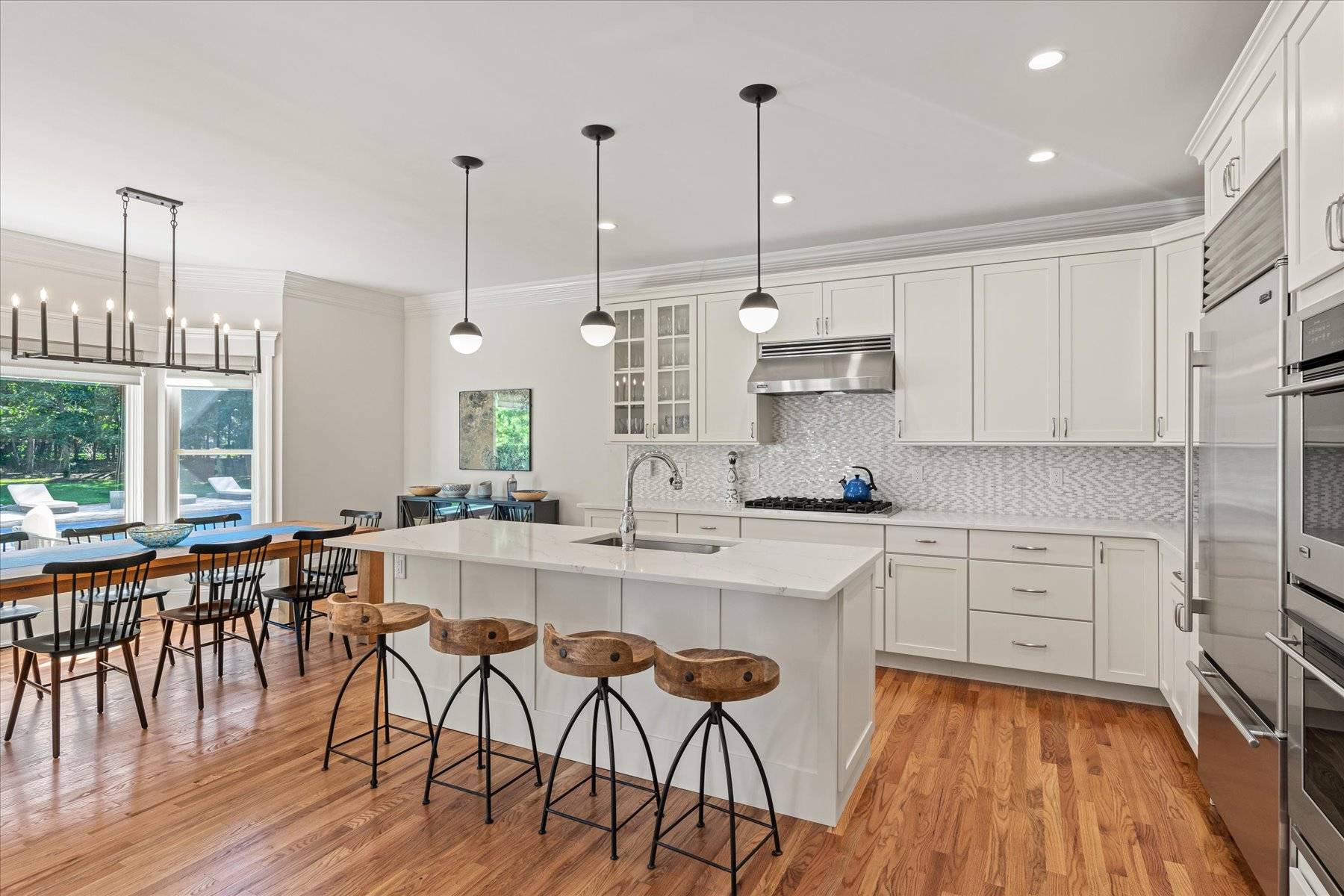 33 Post Fields Lane Quogue, NY 11959 - Photo 30 of 30 a large kitchen with cabinets table and chairs