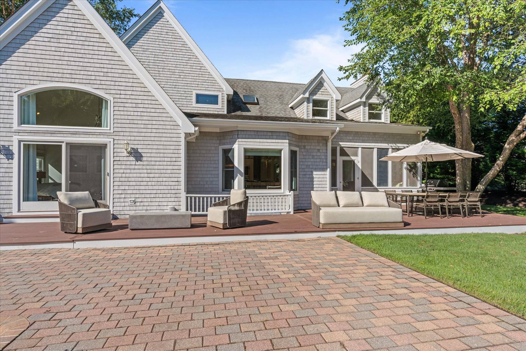 33 Post Fields Lane Quogue, NY 11959 - Photo 30 of 30 a front view of a house with a yard