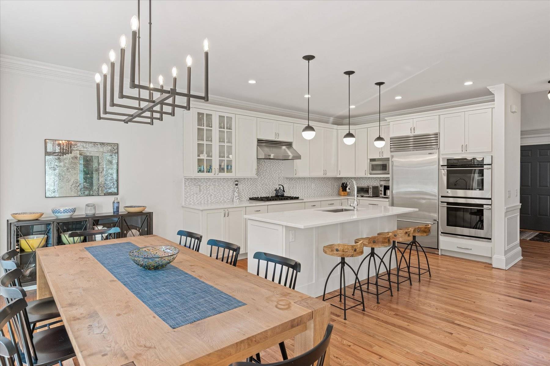 33 Post Fields Lane Quogue, NY 11959 - Photo 5 of 30 a large kitchen with a table and chairs