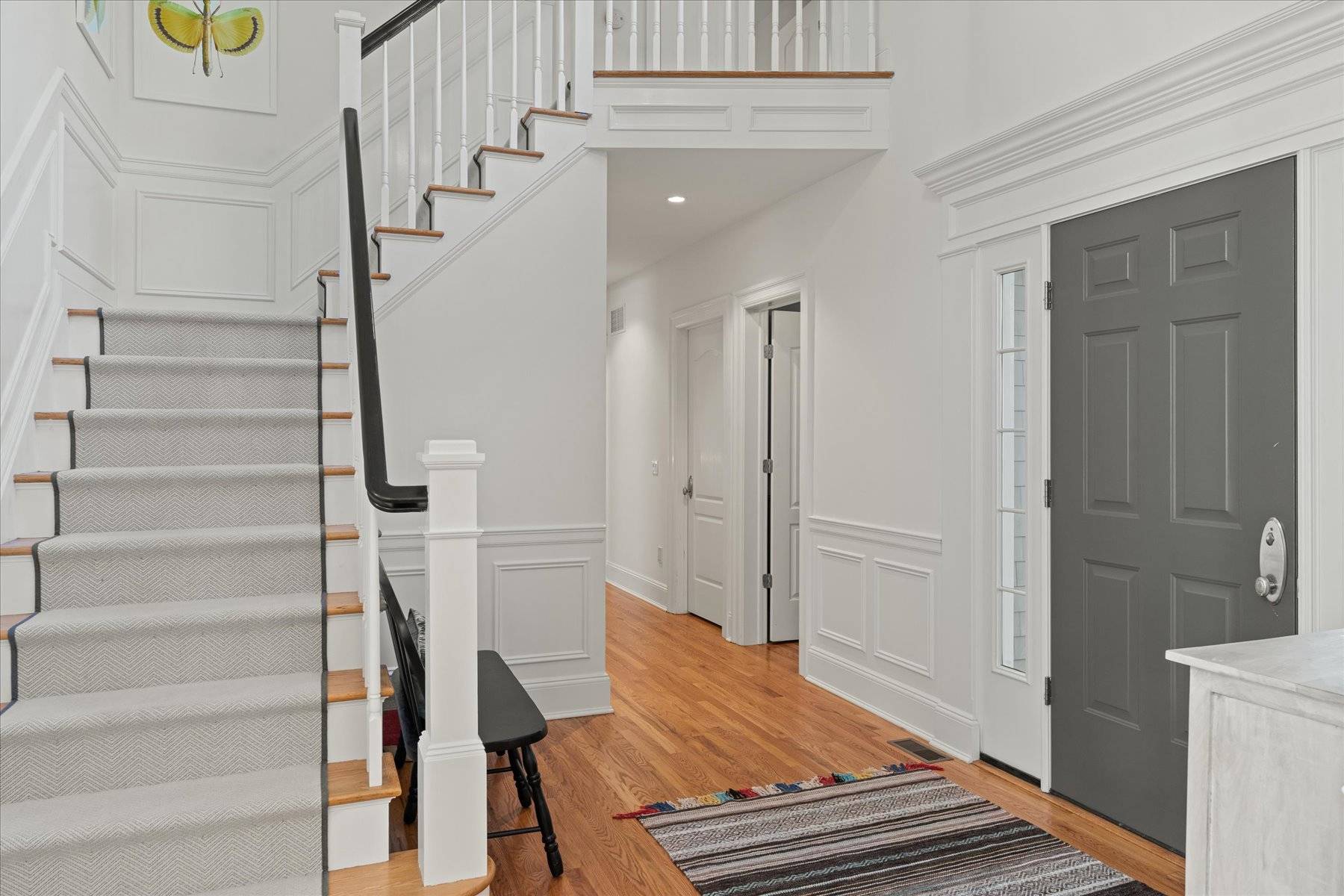 33 Post Fields Lane Quogue, NY 11959 - Photo 6 of 30 a view of entryway and hall with wooden floor