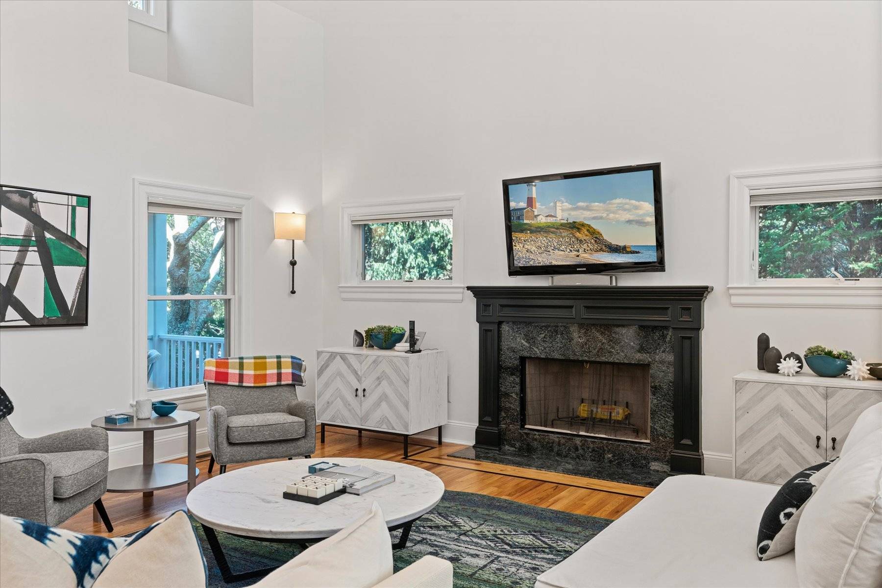 33 Post Fields Lane Quogue, NY 11959 - Photo 7 of 30 a living room with furniture and a fireplace