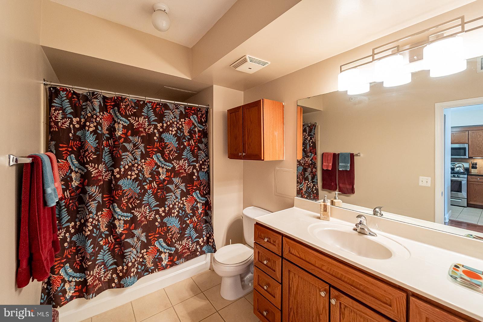 631 D Street Northwest, Unit 1231 Washington, DC 20004 - Photo 14 of 48 a bathroom with a sink toilet and shower