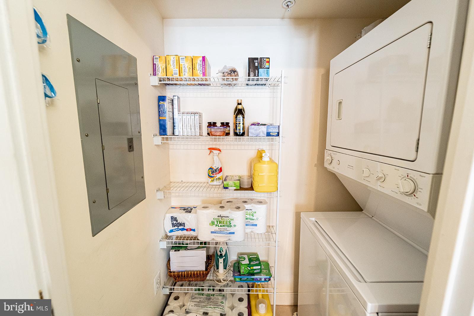631 D Street Northwest, Unit 1231 Washington, DC 20004 - Photo 15 of 48 a room with refrigerator and clutter