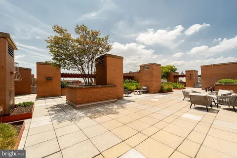 a view of a terrace with seating area