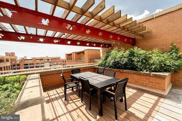 a view of a terrace with sitting area