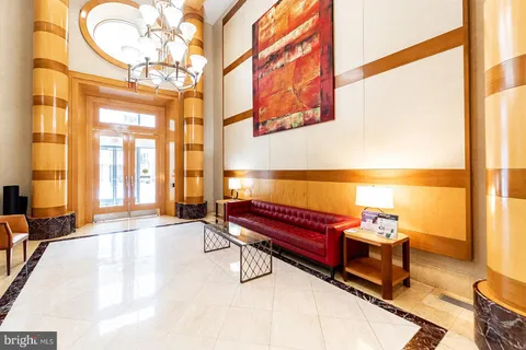 a living room with furniture fireplace and flat screen tv