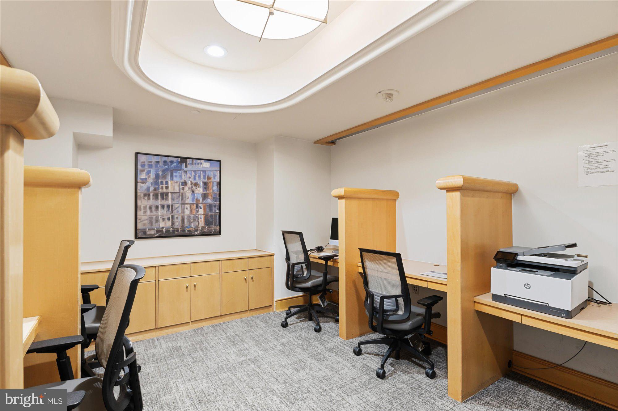 631 D Street Northwest, Unit 1231 Washington, DC 20004 - Photo 35 of 48 a view of a workspace with furniture and a window
