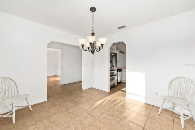 a big room with wooden floor and closet in a room