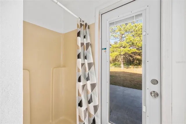 a view of an empty room with a window