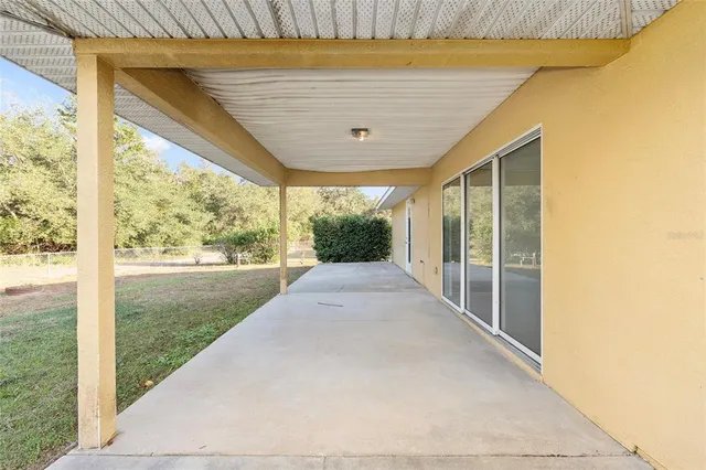 a view of yard along with trees