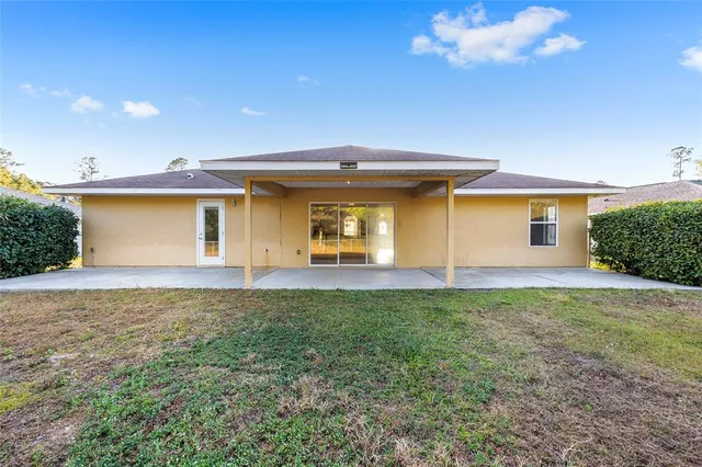 an aerial view of a house with swimming pool and mountain view