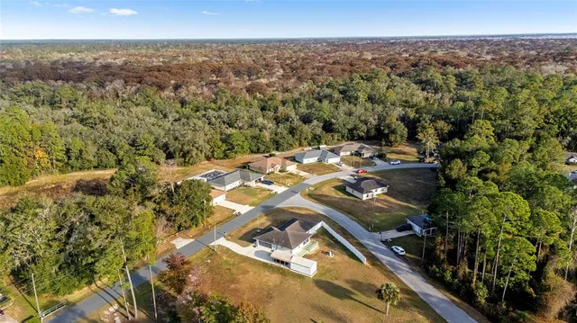an aerial view of residential house with outdoor space