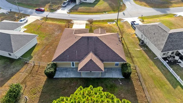 an aerial view of residential house with parking space