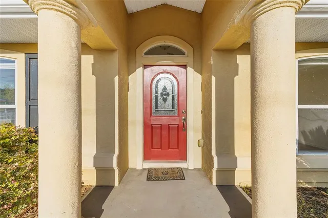a view of a hallway with front door