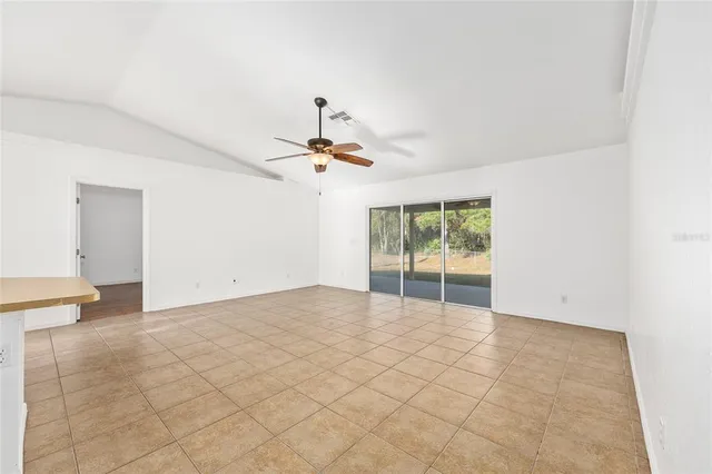 a kitchen with a stove a sink and a refrigerator
