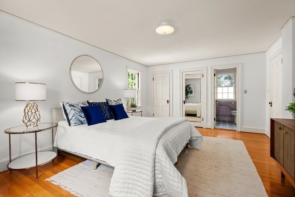 70 Edgemoor Road Belmont, MA 02478 - Photo 13 of 24 a bed room with a bed mirror and a lamp
