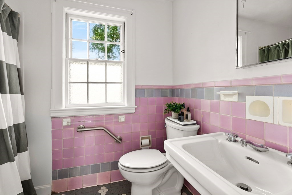 70 Edgemoor Road Belmont, MA 02478 - Photo 15 of 24 a bathroom with a sink toilet mirror and tub