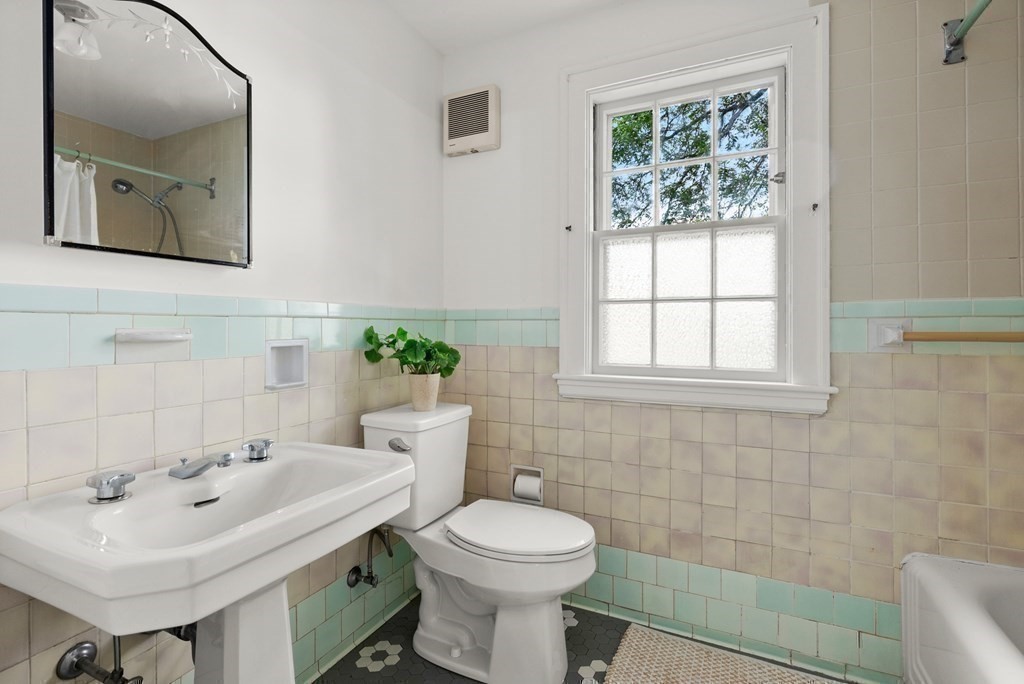 70 Edgemoor Road Belmont, MA 02478 - Photo 17 of 24 a bathroom with a sink a toilet and mirror