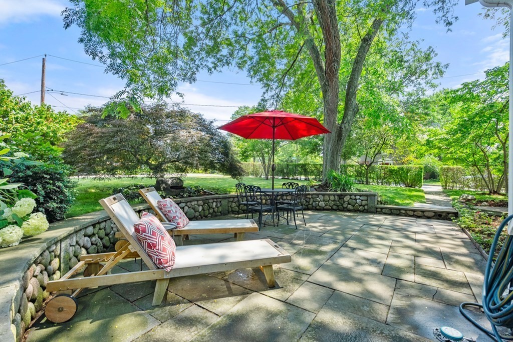 70 Edgemoor Road Belmont, MA 02478 - Photo 21 of 24 a view of a backyard with sitting area and furniture