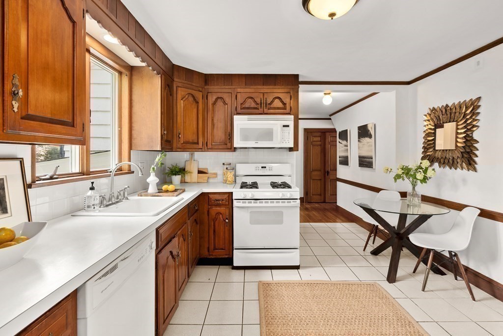 70 Edgemoor Road Belmont, MA 02478 - Photo 9 of 24 a kitchen with a sink cabinets and window