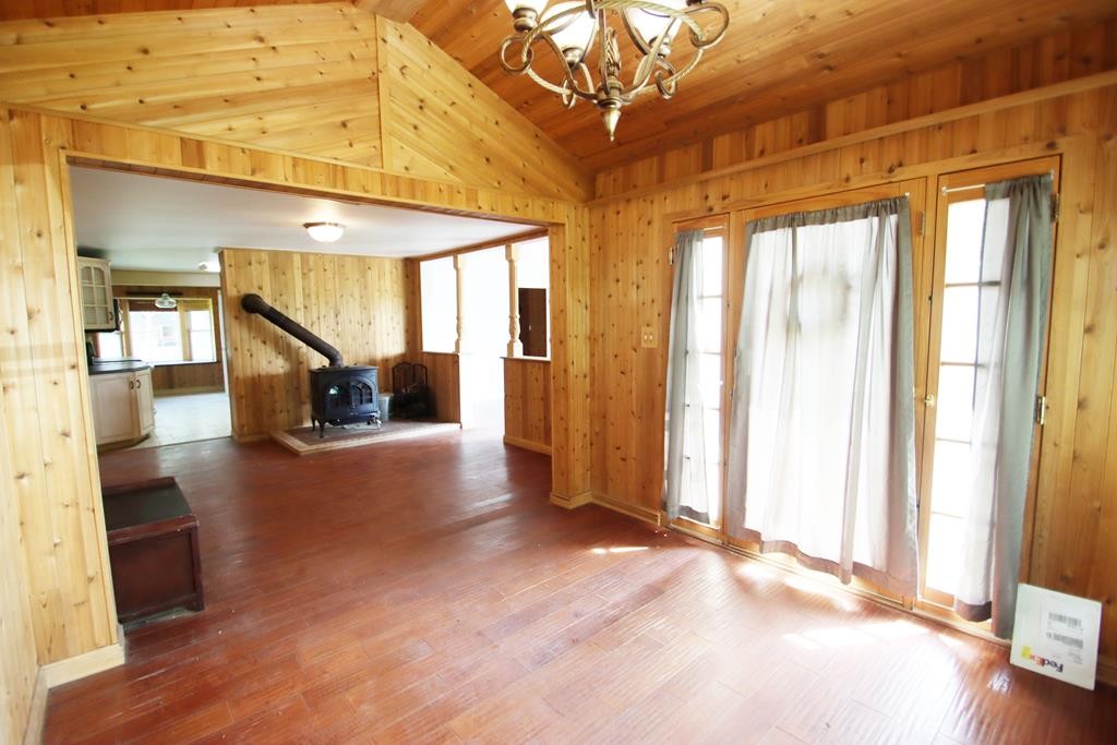 777 Lovejoy Road Sparta, TN 38583 - Photo 6 of 47 a view of empty room with wooden floor and windows