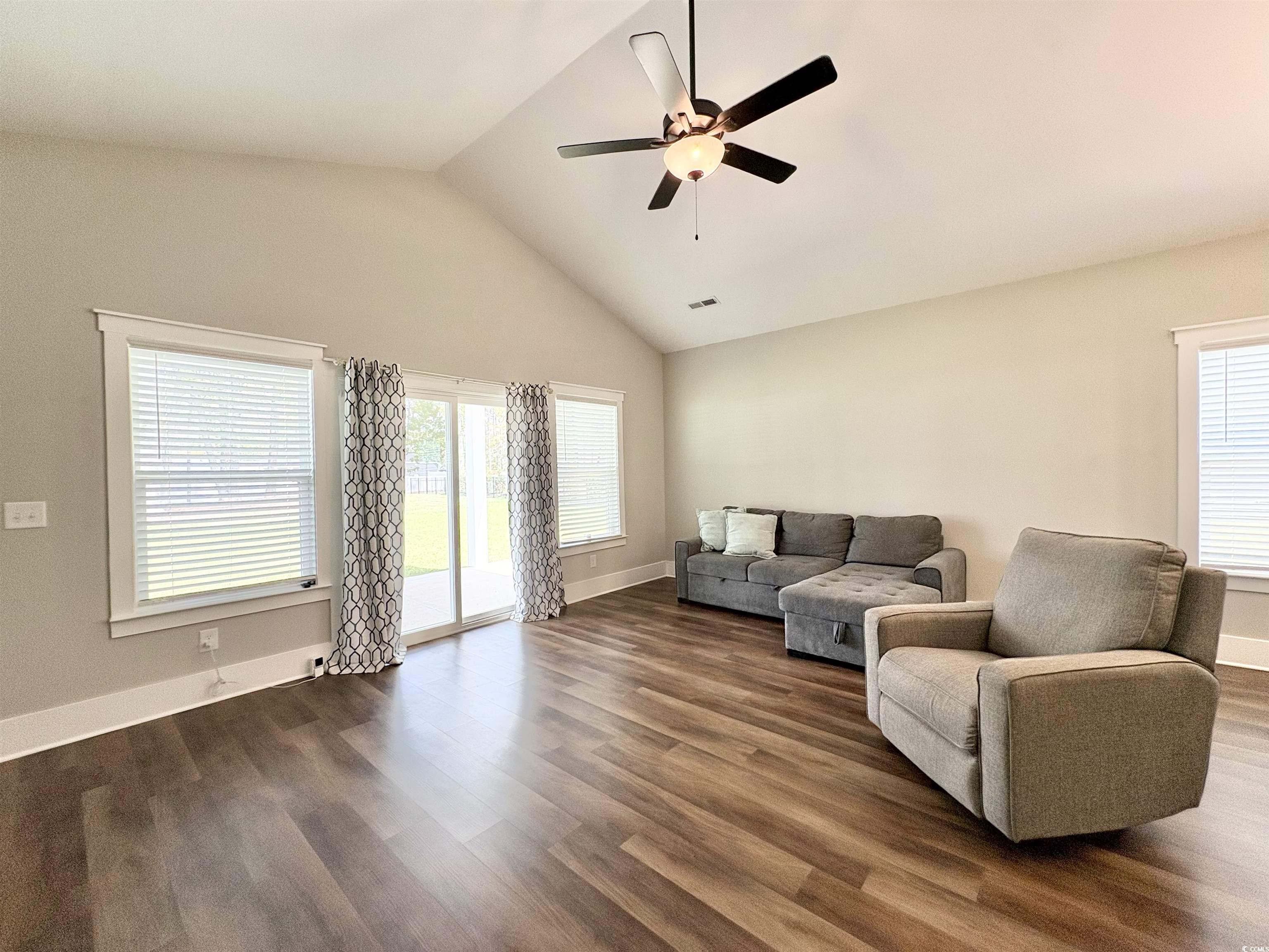 11124 Lee Circle Murrells Inlet, SC 29576 - Photo 14 of 25 Living room featuring dark wood-type flooring, cei