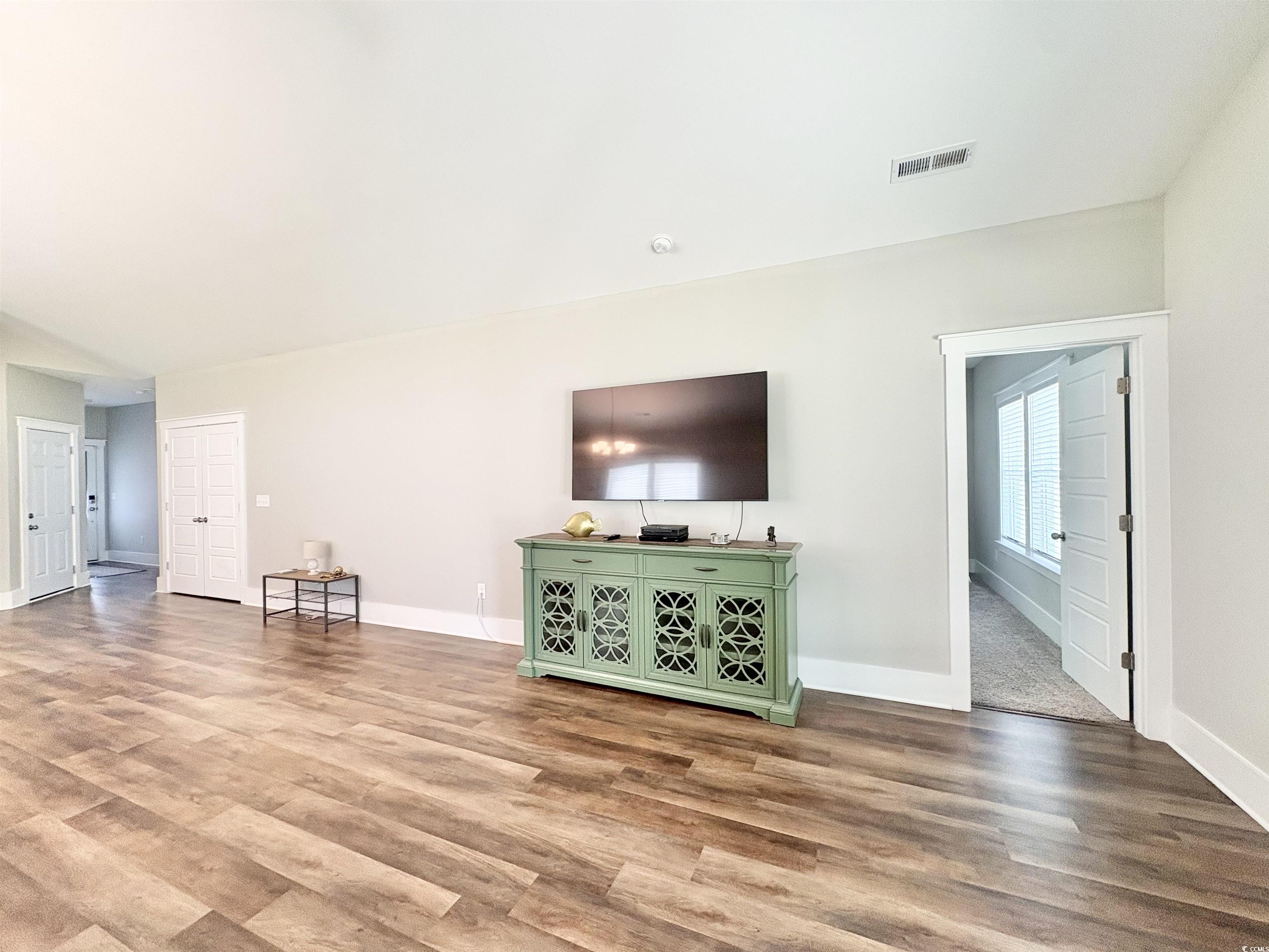 11124 Lee Circle Murrells Inlet, SC 29576 - Photo 15 of 25 Unfurnished living room with visible vents, basebo