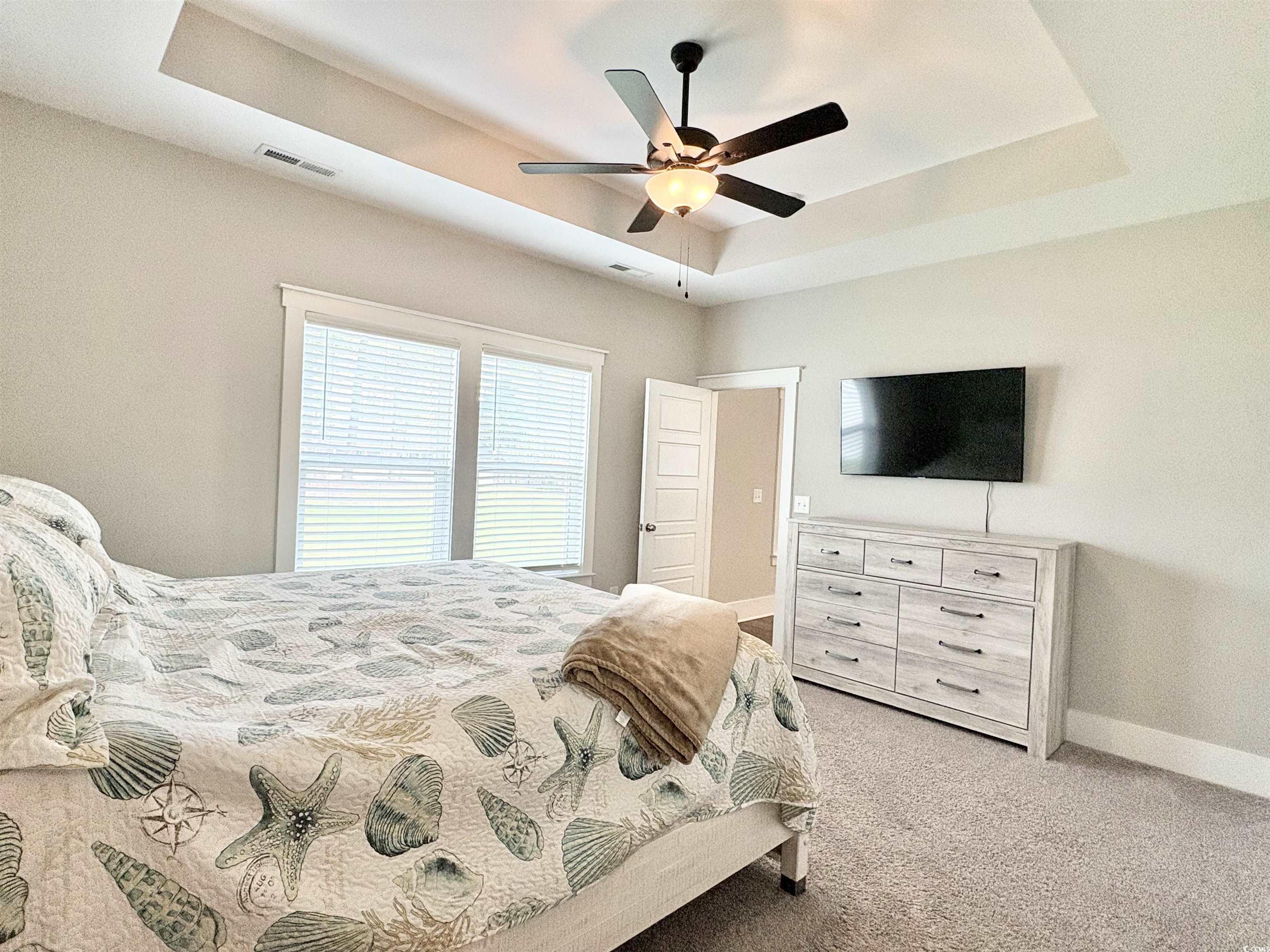11124 Lee Circle Murrells Inlet, SC 29576 - Photo 20 of 25 Bedroom featuring baseboards, light carpet, a ceil