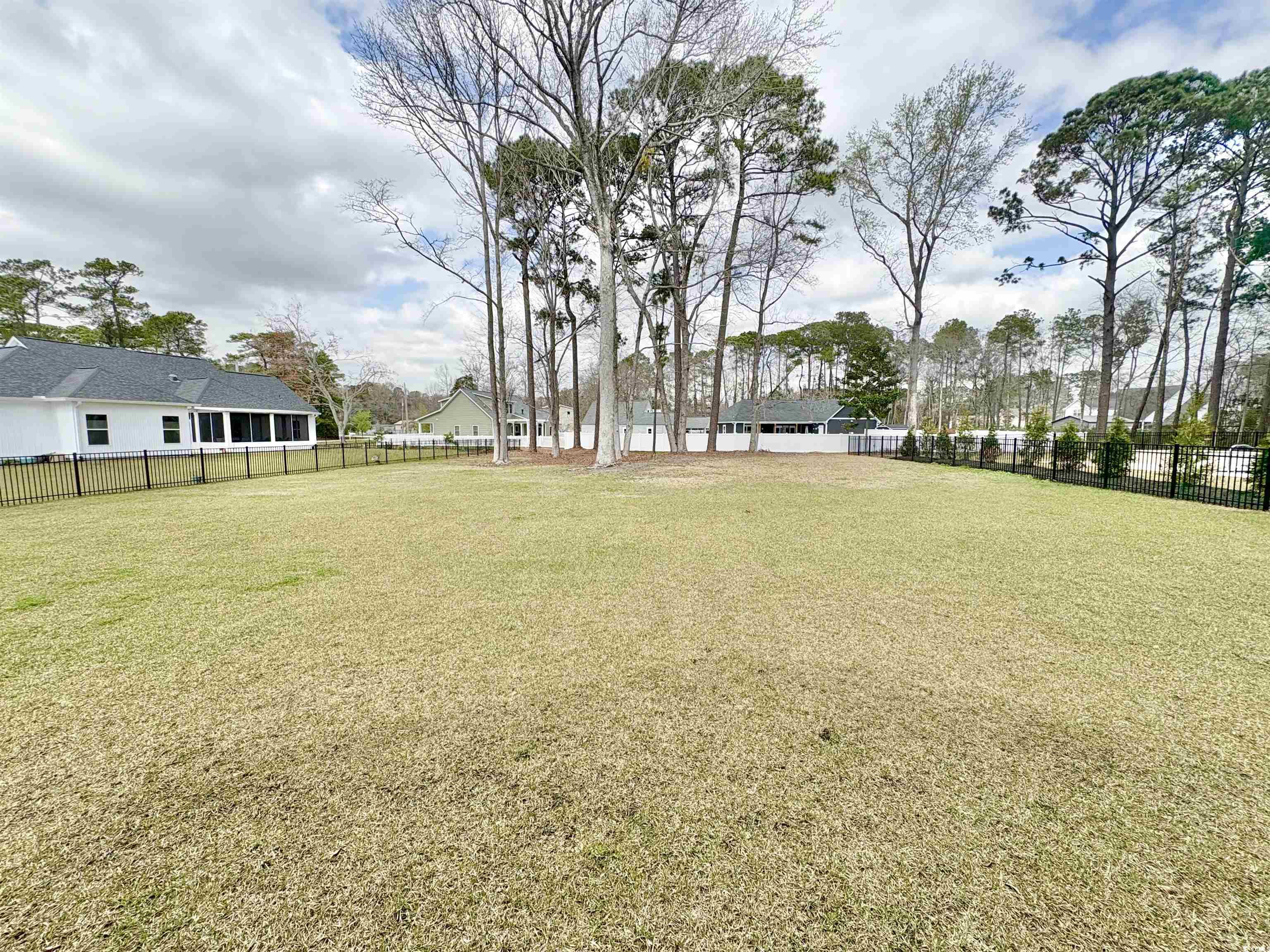 11124 Lee Circle Murrells Inlet, SC 29576 - Photo 25 of 25 View of yard with a fenced backyard