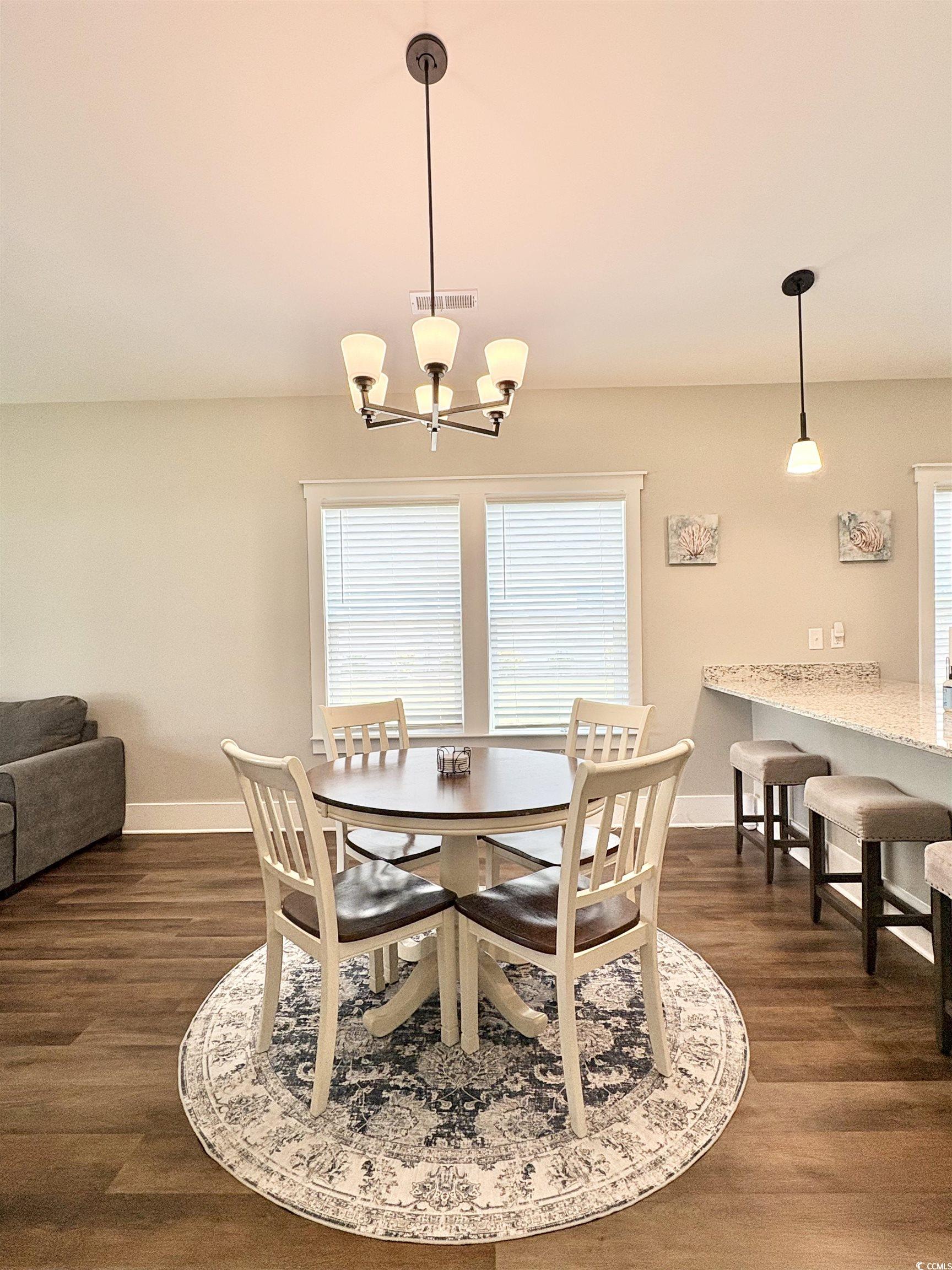 11124 Lee Circle Murrells Inlet, SC 29576 - Photo 7 of 25 Dining space with dark wood-type flooring, visible