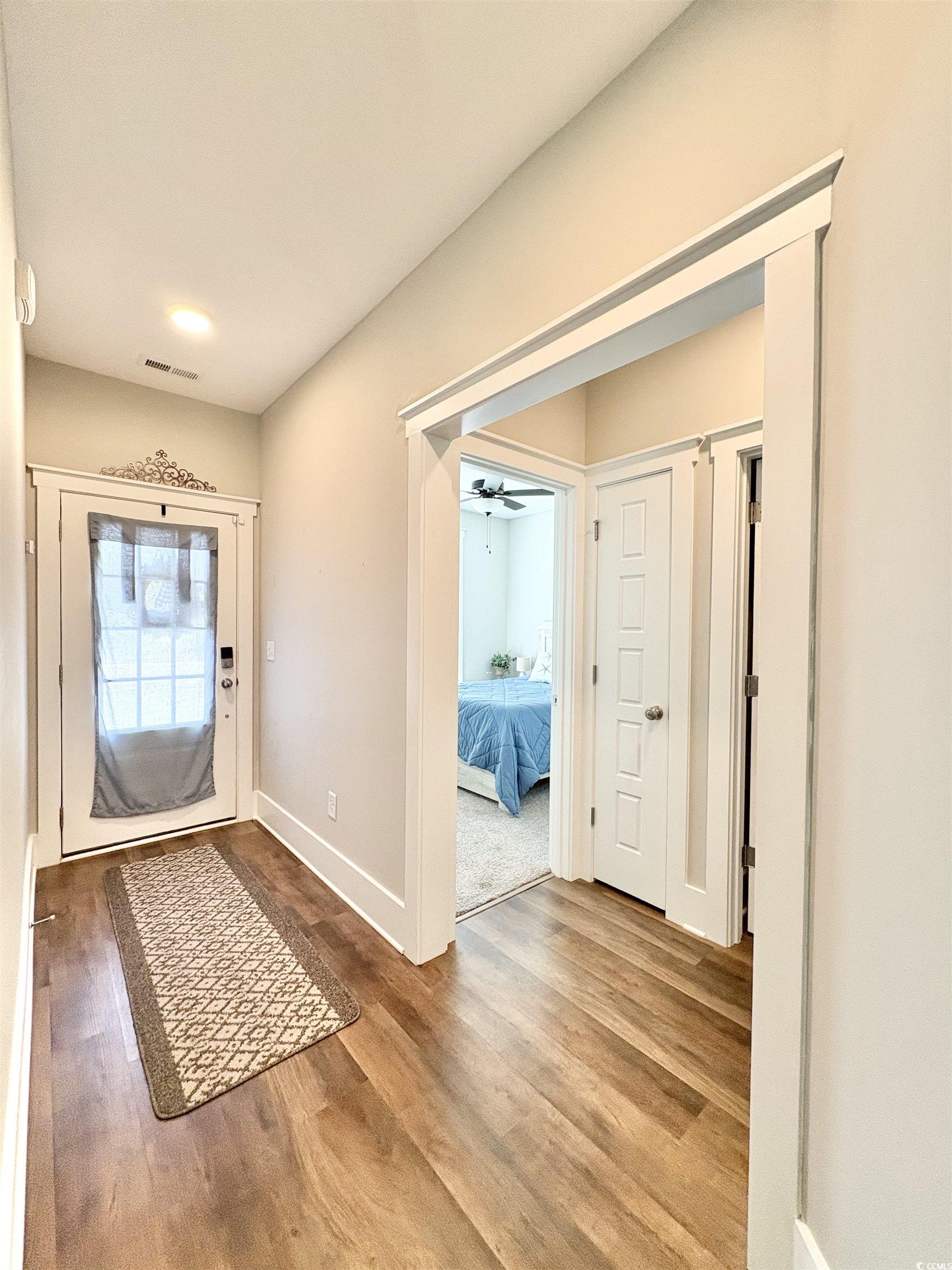 11124 Lee Circle Murrells Inlet, SC 29576 - Photo 8 of 25 Entryway featuring wood finished floors, baseboard