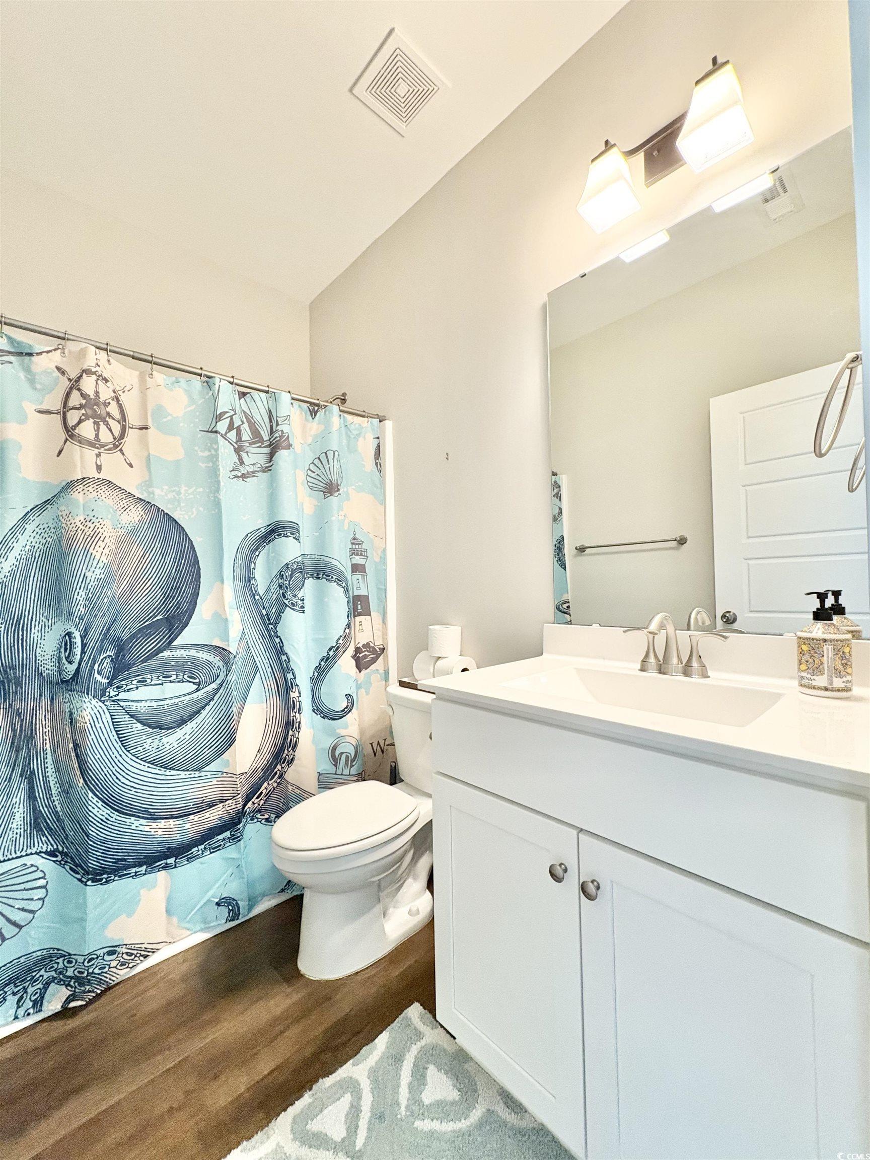 11124 Lee Circle Murrells Inlet, SC 29576 - Photo 10 of 25 Bathroom featuring visible vents, toilet, vanity,