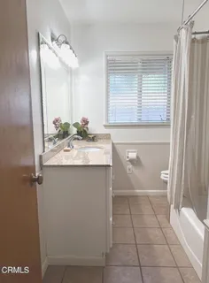 a bathroom with a sink a vanity and a mirror
