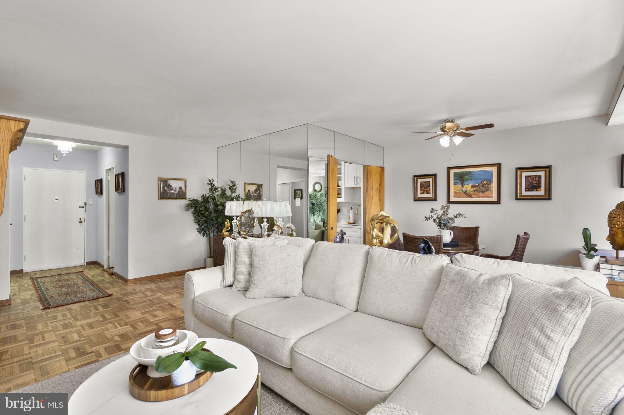 2475 Virginia Avenue Northwest, Unit 620 Washington, DC 20037 - Photo 14 of 30 a living room with furniture and a table