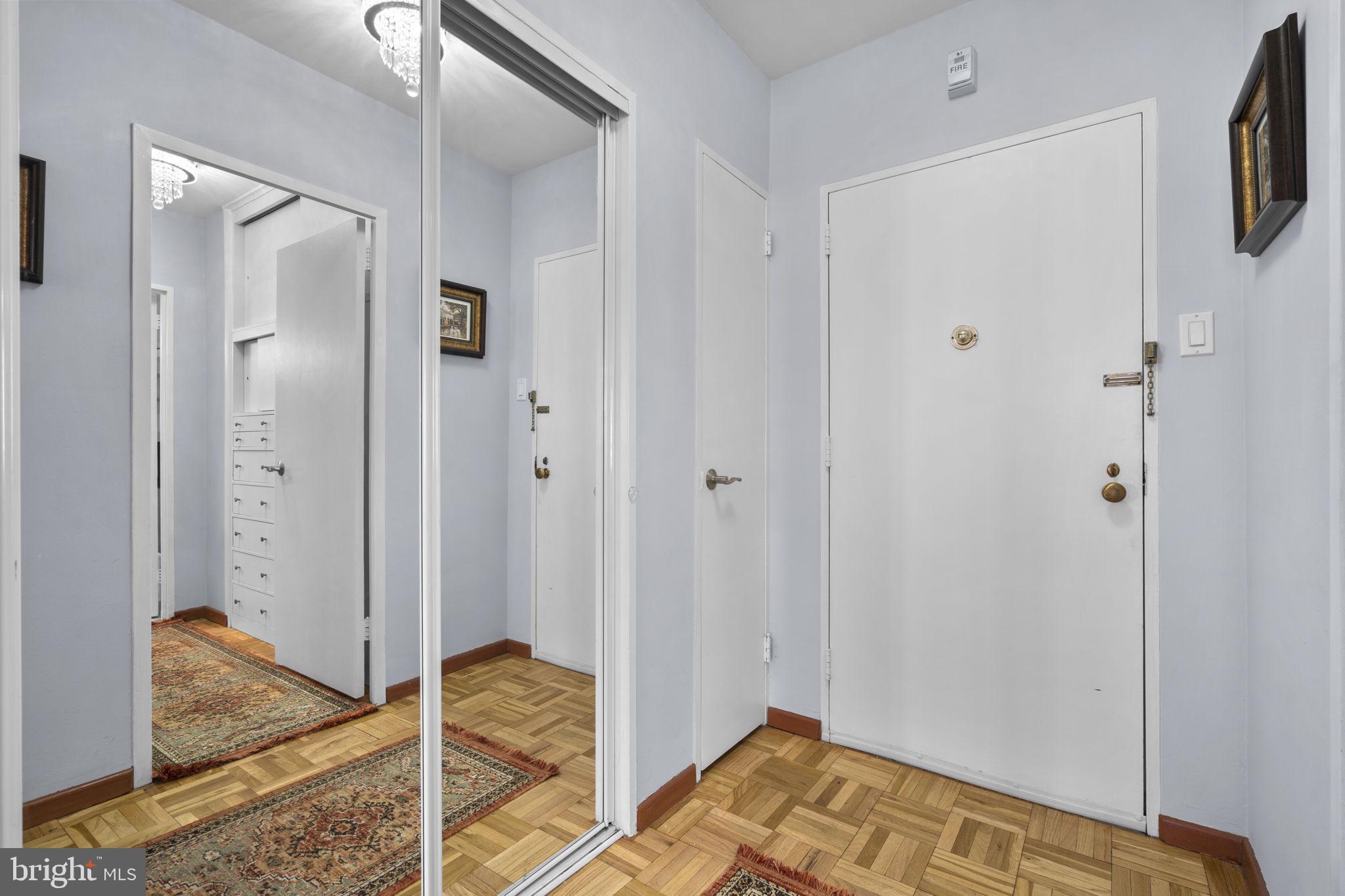 2475 Virginia Avenue Northwest, Unit 620 Washington, DC 20037 - Photo 6 of 30 a bedroom with a bed and a chandelier fan