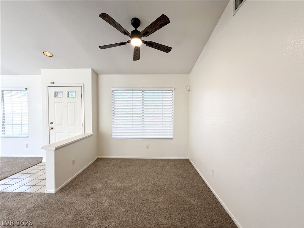 8870 Haviland Road Las Vegas, NV 89123 - Photo 6 of 22 A versatile living space with a classic front entry and textured wall finishes.