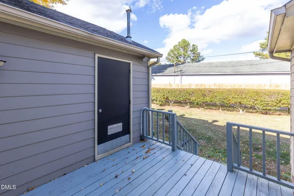 a view of a balcony with wooden floor