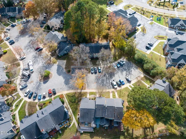 an aerial view of residential houses with outdoor space
