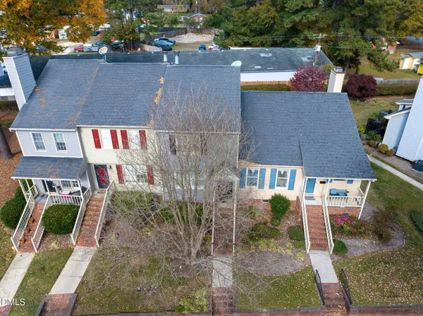 an aerial view of a house with a yard