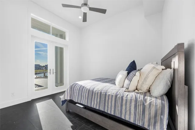 a bedroom with a bed and a mirror